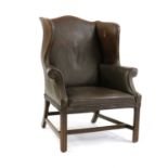 A George III-style wingback armchair,