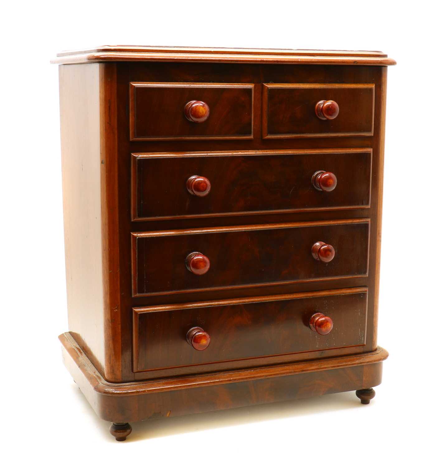 An Edwardian miniature mahogany chest of drawers,