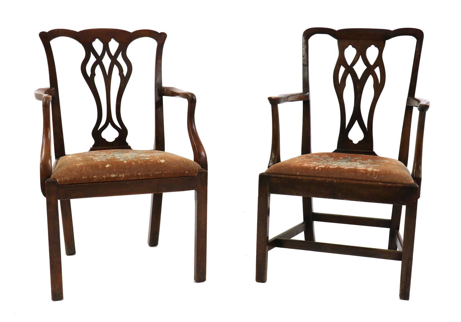 A near pair of George III mahogany elbow chairs,