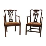 A near pair of George III mahogany elbow chairs,