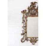 A carved giltwood pier glass in the manner of Thomas Johnson,