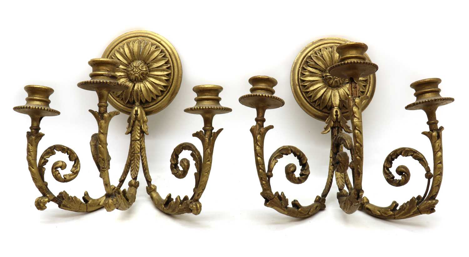 A pair of gilt and composition wall sconces