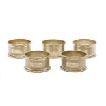 A set of four silver napkin rings,