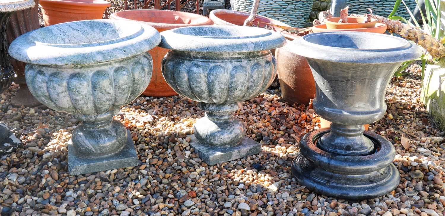 A pair of granite garden urns