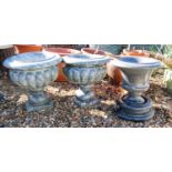 A pair of granite garden urns