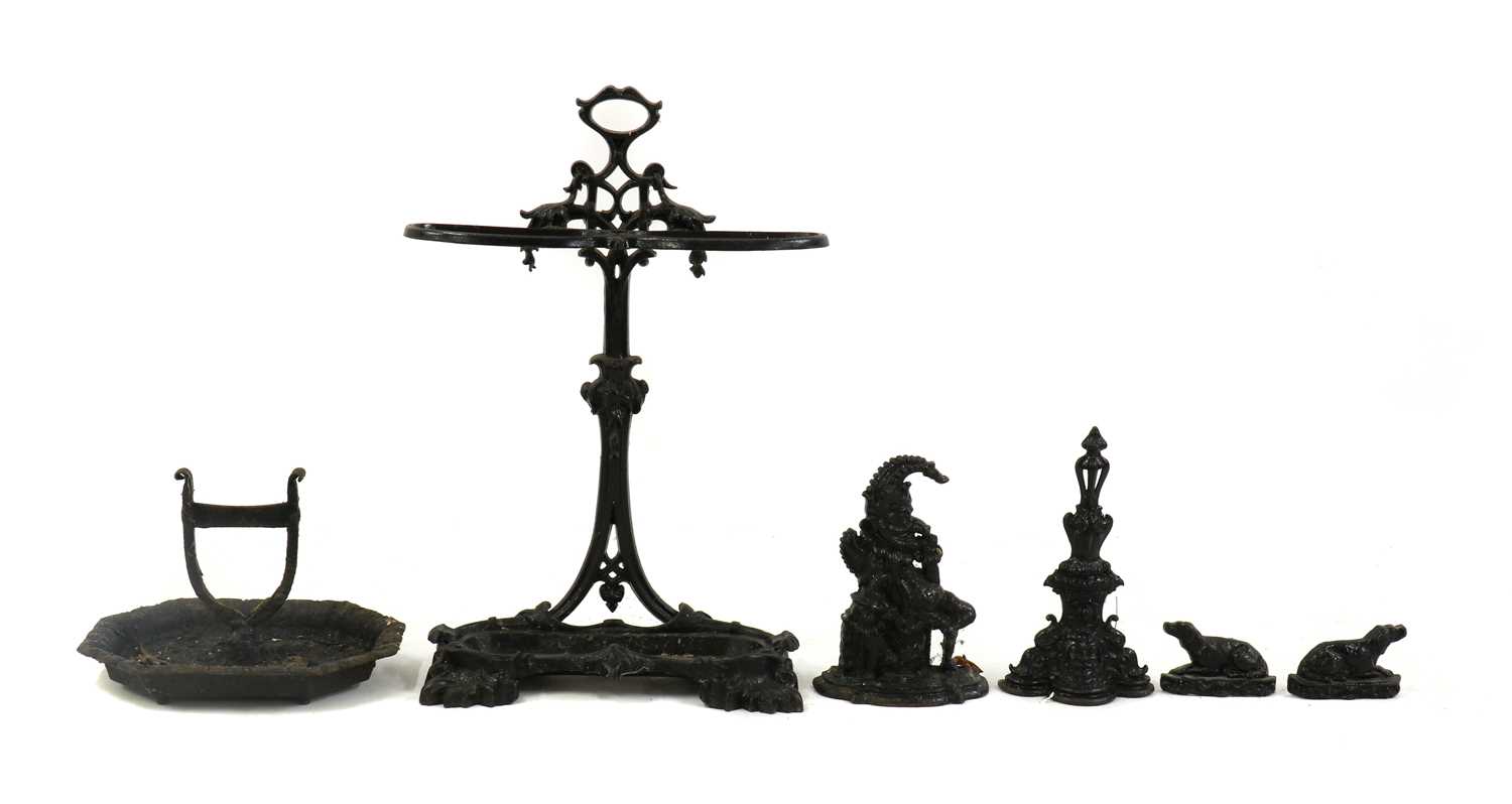 A black painted iron stick stand