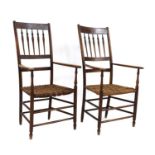 A pair of American cedar and elm elbow chairs