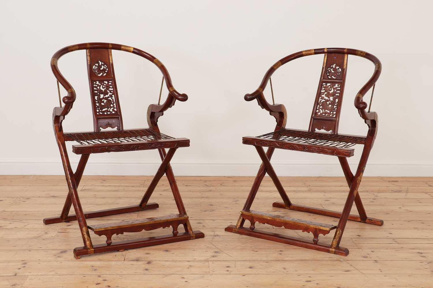 A pair of Chinese hardwood horseshoe-back folding chairs, - Image 2 of 9
