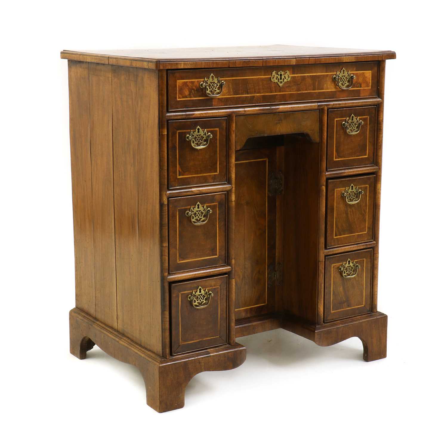 A George I style strung walnut kneehole desk,