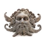 A bronze wall mask of Poseidon,