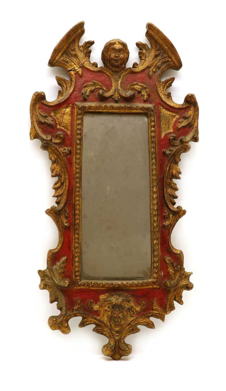 A Baroque style parcel gilt mirror