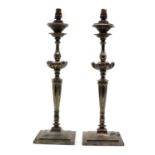 A pair of silver plated table lamps,