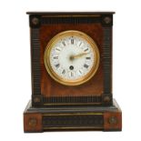 A Victorian ebonised and burr yew mantel timepiece