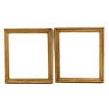 A pair of stripped pine frames,