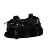 A Salvatore Ferragamo black suede and patent leather handbag,