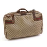 A Vintage Gucci soft-sided suitcase,