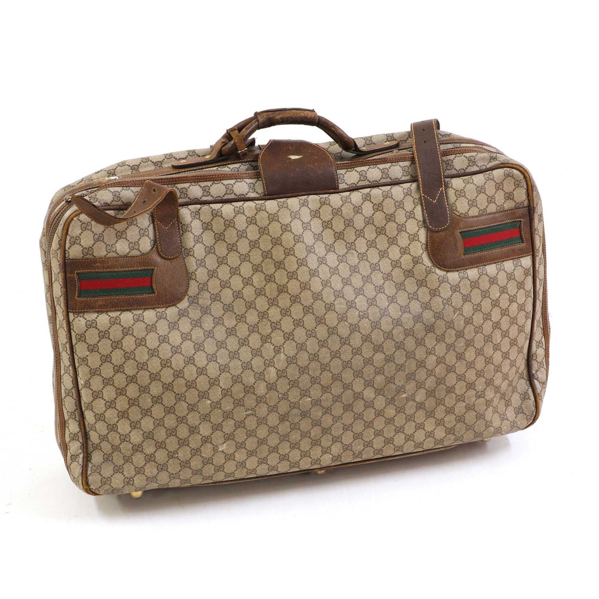 A Vintage Gucci soft-sided suitcase,