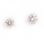 A pair of platinum diamond stud earrings,
