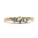 A gold three stone diamond ring,