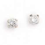 A pair of 9ct two colour gold single stone diamond stud earrings,