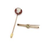 An early 20th Century gold peridot and split pearl bar brooch,