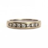 An 18ct white gold half eternity ring,