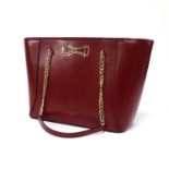 A Ted Baker red tote bag and matching purse