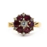 An 18ct gold ruby and diamond target cluster ring,