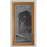 A pair of large Art Deco etched glass panels,