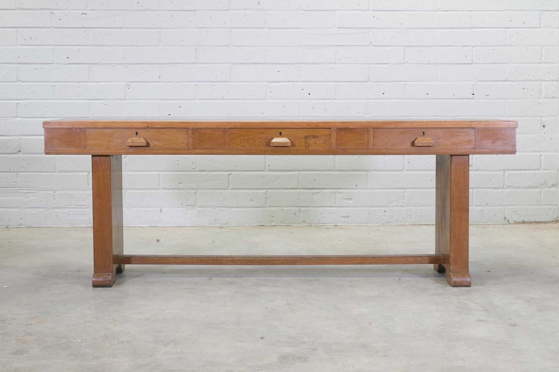 An oak three-drawer serving table,
