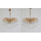 A pair of gilt-brass chandeliers,