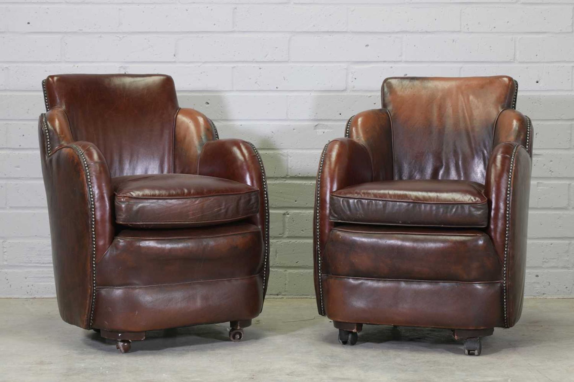A pair of Art Deco leather club armchairs,