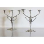A pair of pewter candelabra,