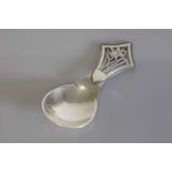 An Arts & Crafts silver caddy spoon,