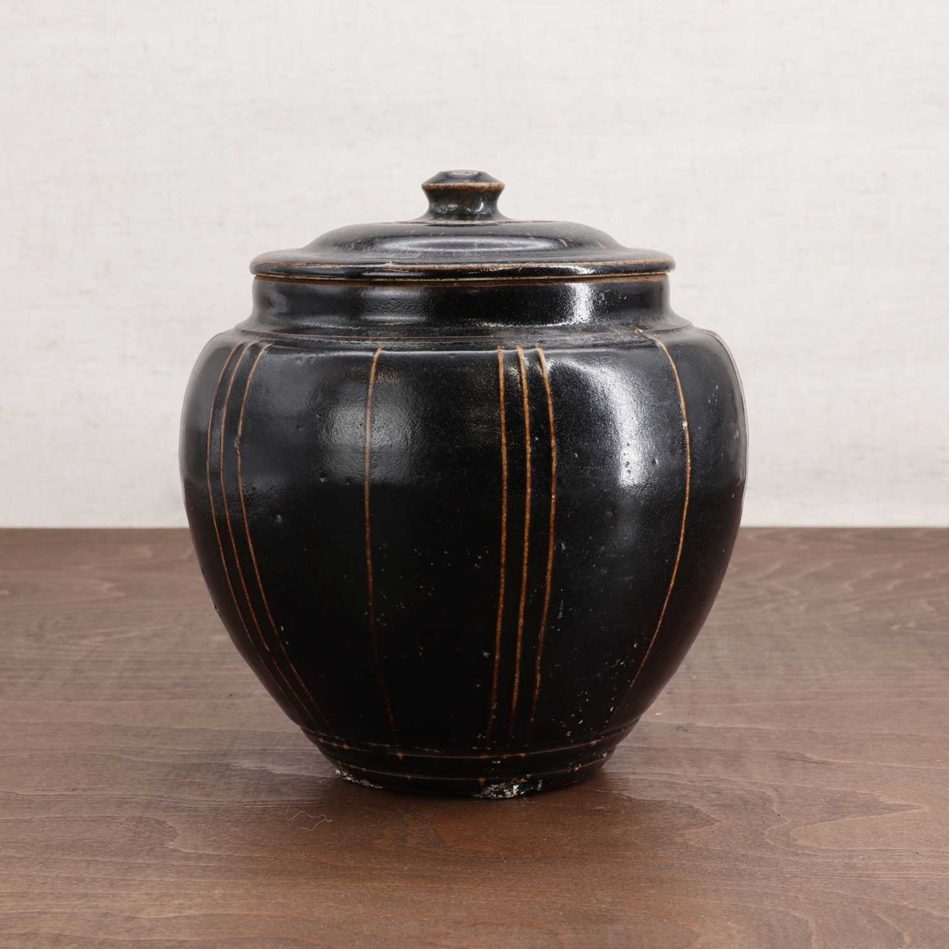 A Chinese stoneware jar and cover,