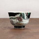 A Chinese famille noire cup,