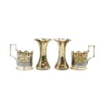 A pair of Russian style silver cup holders,