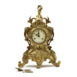 A cast brass mantel clock