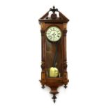 A Victorian walnut Vienna regulator wall clock