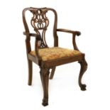 A George III-style mahogany and parcel-gilt open armchairlate 19th century, with rococo decoration,