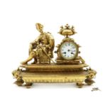 A gilt metal Empire style mantel clock,
