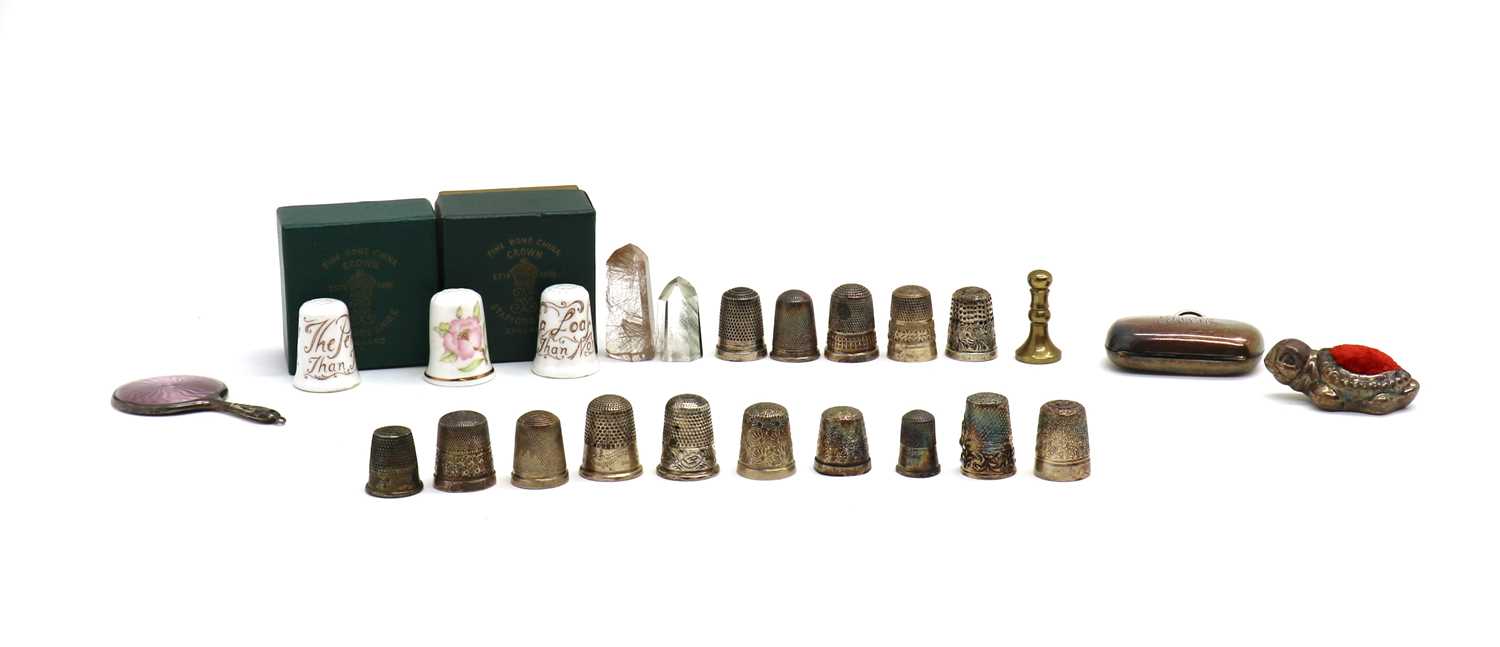 A collection of fourteen silver thimbles