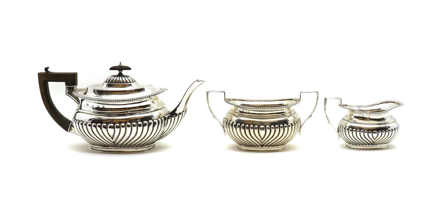 A silver three piece tea service