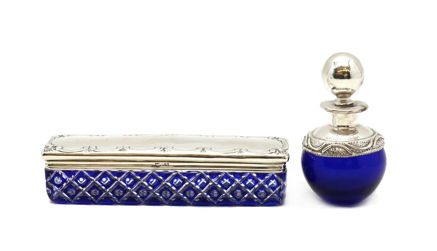 A silver topped blue cased glass box
