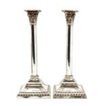 A pair of Victorian silver candlesticks,