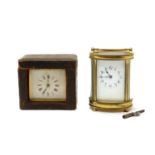 A oval brass carriage clock,