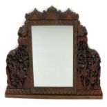 A carved hardwood overmantel mirror,