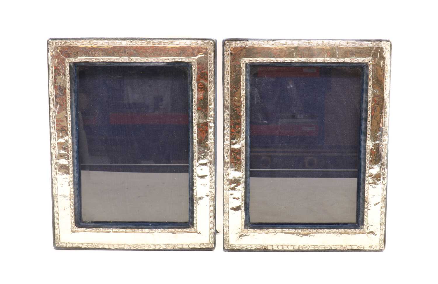 A pair of silver photograph frames