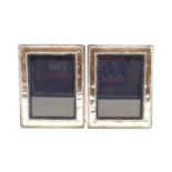 A pair of silver photograph frames