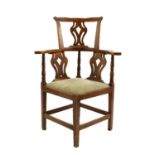 A George III walnut corner chair,